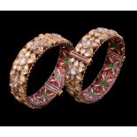 Two Indian enamel and diamond bracelets, the hinged bangle set with lasque cut diamonds in a