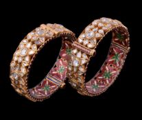 Two Indian enamel and diamond bracelets, the hinged bangle set with lasque cut diamonds in a