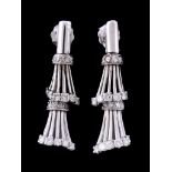 A pair of diamond earrings, the reeded drops set with brilliant cut diamonds and eight cut