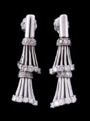 A pair of diamond earrings, the reeded drops set with brilliant cut diamonds and eight cut