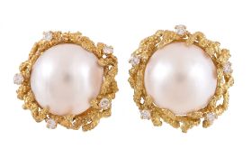 A pair of mabe pearl and diamond ear clips by Garrard & Co , the mabe pearls within a textured