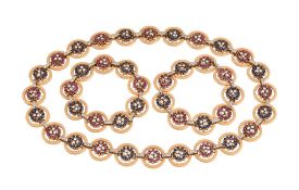 A 1960s diamond, ruby and sapphire necklace and two bracelets, the links composed of gold coloured