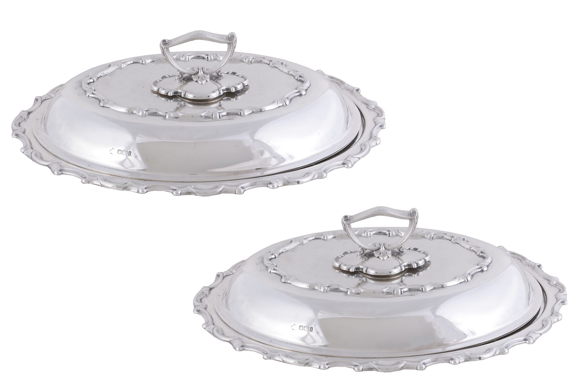 A pair of late Victorian silver shaped oval entree dishes, covers and handles by William Hutton &