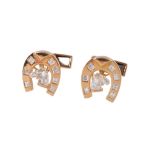 A pair of French 18 carat gold and diamond horseshoe cufflinks by Boucheron, the horseshoe shaped