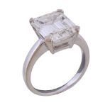 A single stone diamond ring, the step cut diamond with canted corners, weighing 6.31 carats, in
