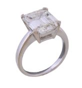 A single stone diamond ring, the step cut diamond with canted corners, weighing 6.31 carats, in