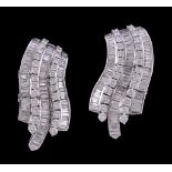 A pair of diamond earrings, the curved panels set with brilliant cut and baguette cut diamonds,