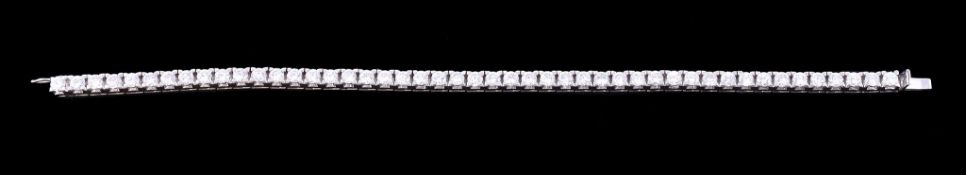 A diamond line bracelet, set with forty seven brilliant cut diamonds, approximately 6.10 carats