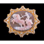 An early Victorian hardstone cameo brooch , circa 1840, carved with Apollo driving a chariot upon a