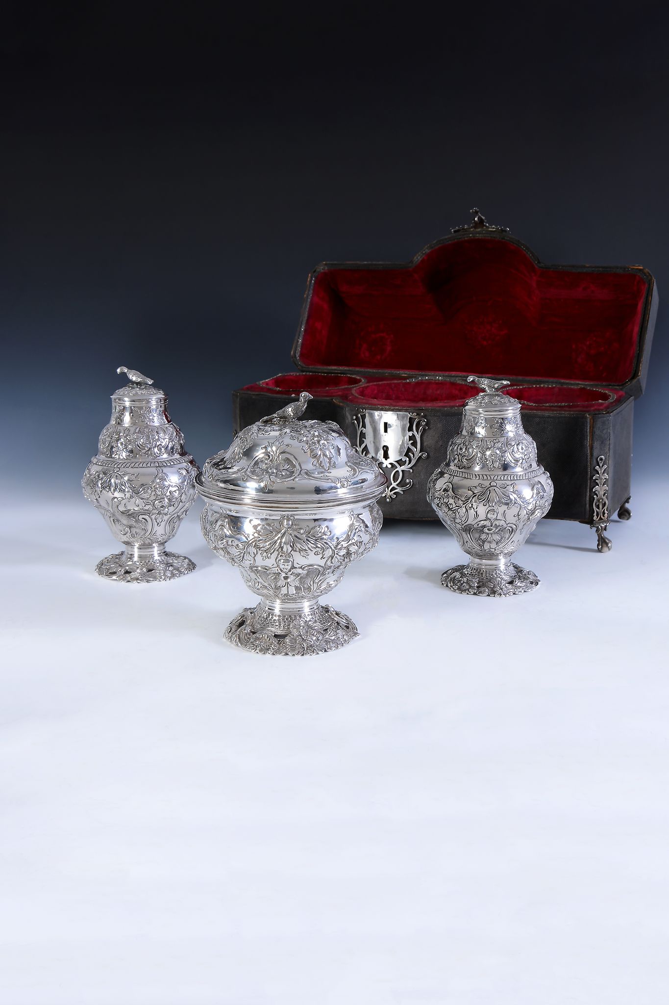 An early George III shagreen caddy box containing a pair of silver tea caddies and a sugar box by