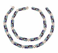A 1970s diamond, turquoise, lapis lazuli and onyx necklace, the polished shaped lapis lazuli and