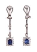 A pair of diamond and sapphire ear pendants , each with a rectangular sapphire and brilliant cut