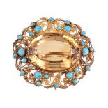 An 1830s turquoise cannetille brooch, the pierced scrolled gold cannetille setting with applied