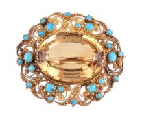 An 1830s turquoise cannetille brooch, the pierced scrolled gold cannetille setting with applied
