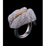 A diamond and emerald peace lily ring, the flower head pave set with brilliant cut diamonds, the