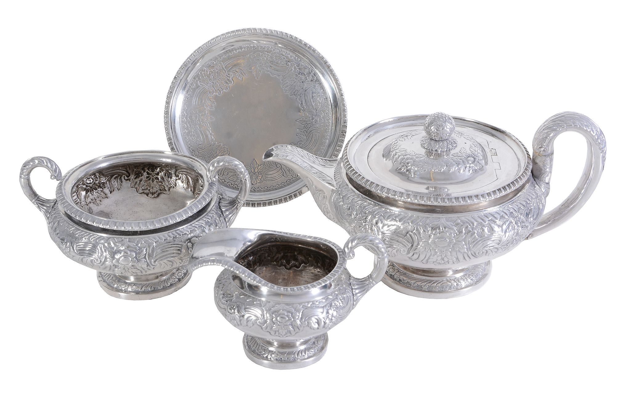 Ω A late George III Scottish silver four piece circular pedestal tea service by Robert Gray & Son of