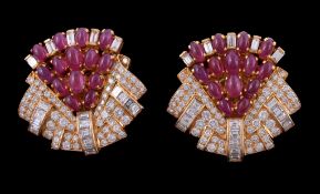 A pair of ruby and diamond earrings, the geometric panels set with oval sugarloaf cabochon rubies,