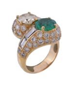 An emerald and diamond crossover dress ring, the brilliant cut diamond weighing 1.84 carats, and