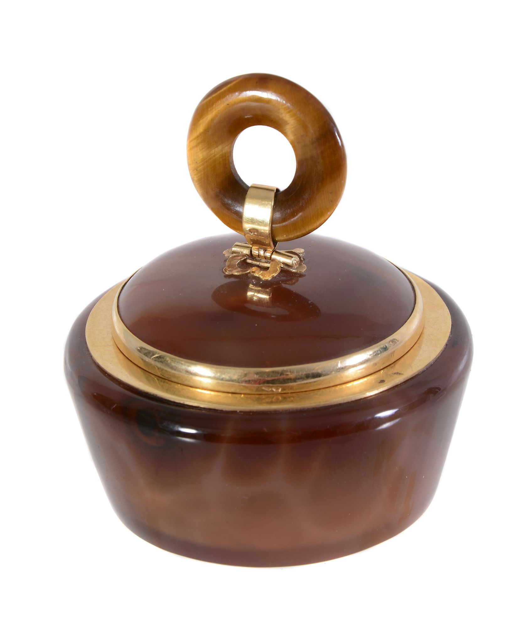 A French Art Deco gold mounted agate circular box and cover, maker's mark AS (not traced), eagle