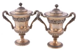A pair of silver gilt small cups and covers by Sebastian Garrard, London 1928, stamped for