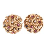 A pair of 1960s diamond, sapphire and ruby bombe flower head ear clips, the dome of en tremblant