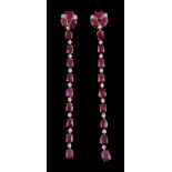 A pair of ruby and diamond earrings, the articulated drops set with alternating oval cut rubies and