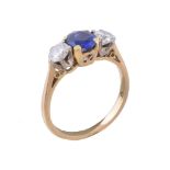 A sapphire and diamond three stone ring, the oval cut sapphire between two brilliant cut diamonds,