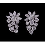 A pair of diamond cluster earrings, set with brilliant cut and marquise cut diamonds, approximately
