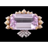 A pink topaz and diamond brooch, the rectangular cut pink topaz in a four claw setting, three sides