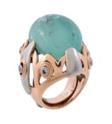 An emerald and diamond dress ring, the tumbled emerald within a two colour surround set with