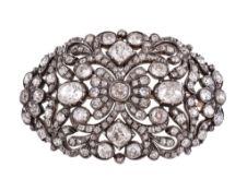 An early Victorian diamond oval brooch, circa 1840, the pierced scrolled foliate gold backed silver