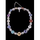 A multi gem set bracelet, with vari cut collet set gemstones, including sapphire, yellow sapphire,