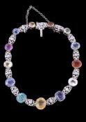 A multi gem set bracelet, with vari cut collet set gemstones, including sapphire, yellow sapphire,