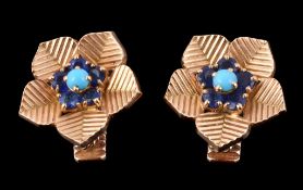A pair of 1960s sapphire and turquoise ear clips by Cartier, designed as flower heads, centrally