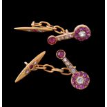 A pair of diamond, ruby and white sapphire cufflinks, the shaped panels with a white sapphire and