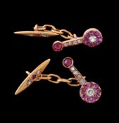 A pair of diamond, ruby and white sapphire cufflinks, the shaped panels with a white sapphire and