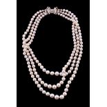 A three strand cultured pearl and diamond necklace, the three rows with graduating cultured pearls,