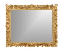 A William IV carved giltwood wall mirror, circa 1835, the rectangular mercury plate within a