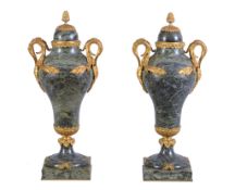 A pair of marble and gilt bronze mounted twin handled urns in Louis XV style, circa 1900, the