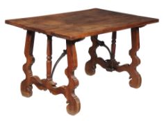 A Spanish walnut centre table , late 17th/ early 18th century, the rectangular top above carved and