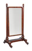 A William IV mahogany cheval mirror , circa 1835, the shaped rectangular plate supported by turned