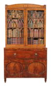 A George III mahogany secretaire bookcase, circa 1800, the arched and crossbanded pediment above a