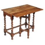 A Charles II walnut side table , circa 1680, the rectangular top with drop leaf to one long side,