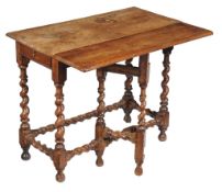 A Charles II walnut side table , circa 1680, the rectangular top with drop leaf to one long side,