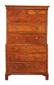 A George II walnut and featherbanded chest on chest, circa 1740, the moulded cornice above two