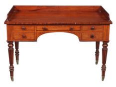 A George IV mahogany dressing table, circa 1825, attributed to Gillows, the top with a three