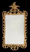 A pair of George III carved giltwood wall mirrors , circa 1780, each rectangular plate within a