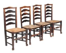 A set of eight elm and rush seated dining chairs , late 18th century, each with ladder back above a