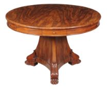 A Charles X mahogany and inlaid drum table , circa 1830, the circular top with central inlaid
