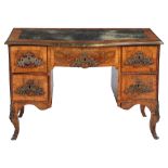 A South German walnut serpentine fronted desk , second quarter 18 th century , the gilt tooled